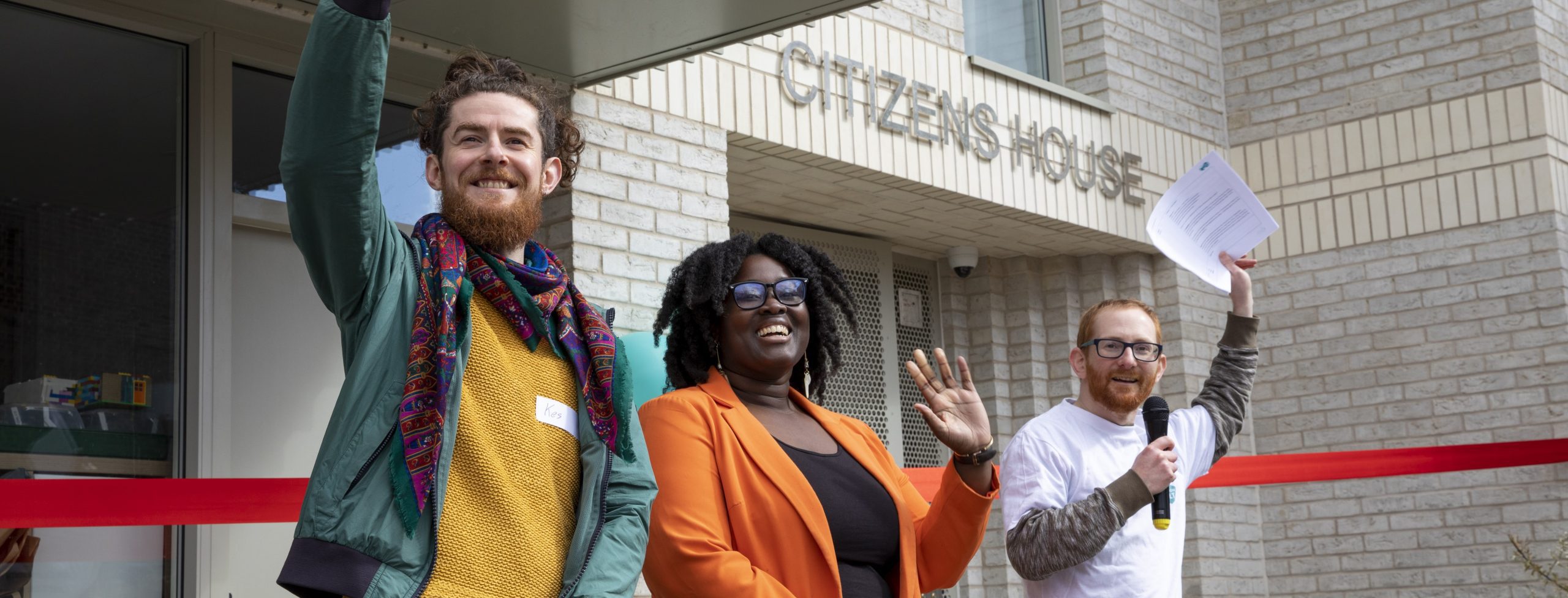 Credit: Yiannis Katsaris Image of 3 people waving at London CLT's Citizen's House opening