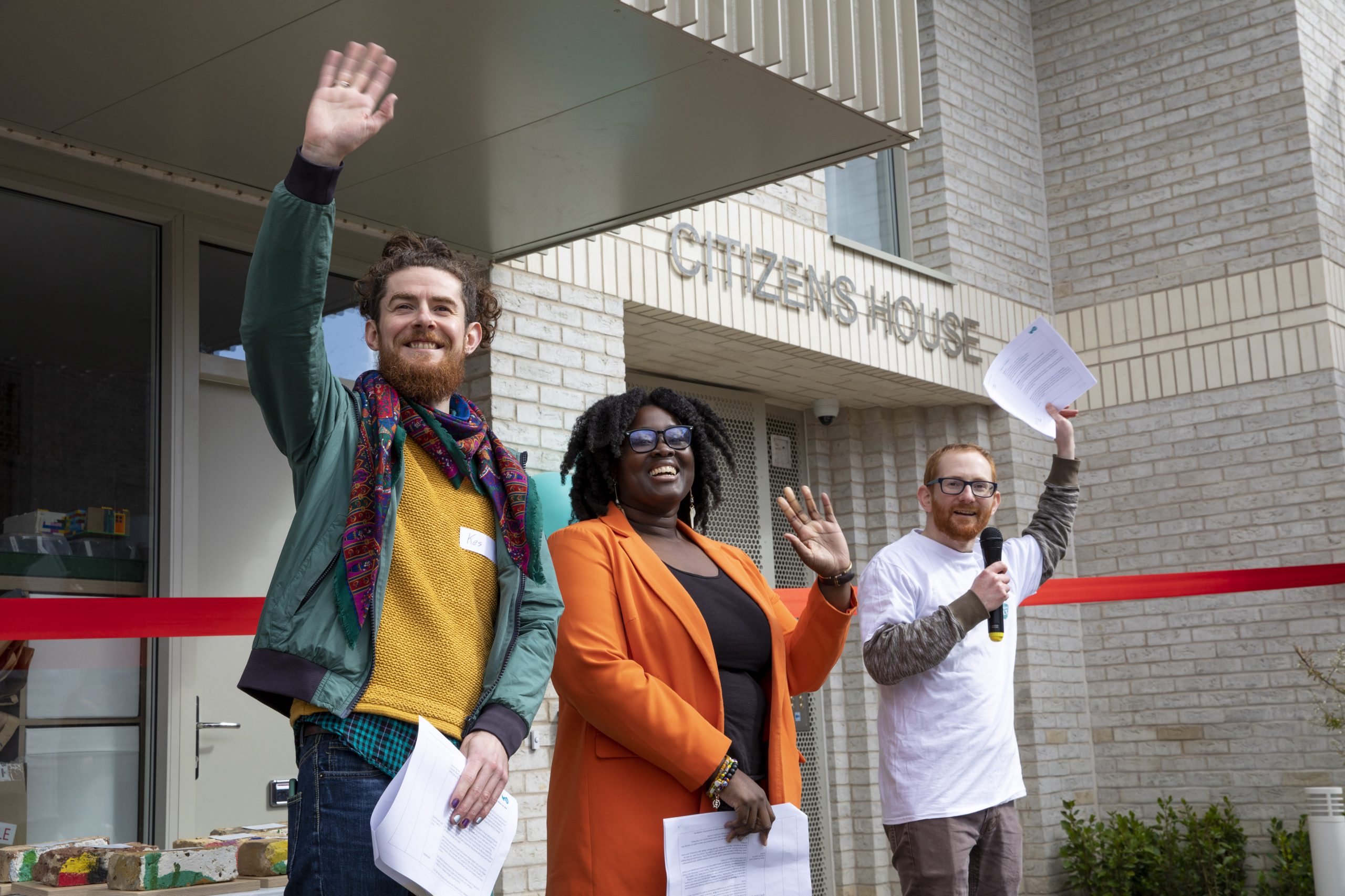 Credit: Yiannis Katsaris Image of 3 people waving at London CLT's Citizen's House opening